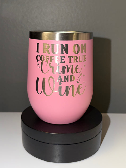 Pink tumbler with gold text on a gray background