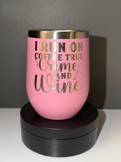 Pink tumbler with gold text on a gray background