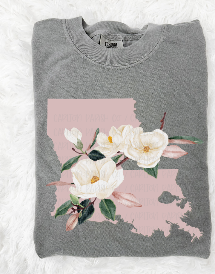Folded gray sweatshirt with a floral design on a white background