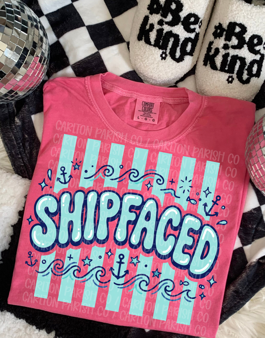 Pink t-shirt with 'SHIPFACED' text on a checkered background